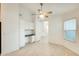 Bright living area with built in cabinets and a pass-through to the kitchen, all with neutral decor at 17514 N Rainbow Cir, Surprise, AZ 85374