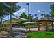 Inviting park featuring covered picnic areas, seating, and lush greenery, perfect for outdoor activities and relaxation at 17514 N Rainbow Cir, Surprise, AZ 85374