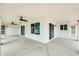 Relaxing covered patio with ceiling fans and view of tropical landscaping at 17514 N Rainbow Cir, Surprise, AZ 85374