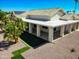 A spacious outdoor living area featuring a covered patio and xeriscaping at 17514 N Rainbow Cir, Surprise, AZ 85374