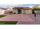 Backyard with patio area, pergola, grill, gravel and turf at 1758 E Birch St, Casa Grande, AZ 85122