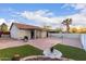 Backyard with patio area, pergola, grill, gravel and turf at 1758 E Birch St, Casa Grande, AZ 85122