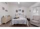 Bright bedroom features neutral carpet, ceiling fan and wrought iron bed frame at 1758 E Birch St, Casa Grande, AZ 85122