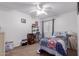 Cozy bedroom with ceiling fan, closet and desk area at 1758 E Birch St, Casa Grande, AZ 85122