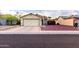 Charming single-story home featuring a two-car garage and mature landscaping at 1758 E Birch St, Casa Grande, AZ 85122