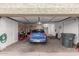 View of the home's organized garage with storage cabinets and ample space for parking a car and other belongings at 1758 E Birch St, Casa Grande, AZ 85122