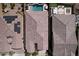 High angle aerial view showcases a tile roof, pool, spa, and putting green at 18233 W Hope Dr, Goodyear, AZ 85338