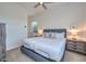 Comfortable bedroom featuring a full bed, white walls, neutral carpet, and a ceiling fan at 18233 W Hope Dr, Goodyear, AZ 85338