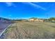 Expansive common area with walking trails and beautiful landscaping, perfect for outdoor activities at 18233 W Hope Dr, Goodyear, AZ 85338