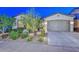 Charming single-story home with well-maintained landscaping and an attached two-car garage at 18233 W Hope Dr, Goodyear, AZ 85338