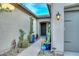 Charming front entrance with desert landscaping, a Ring doorbell, and a decorative front door at 18233 W Hope Dr, Goodyear, AZ 85338