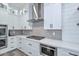 Contemporary kitchen with white cabinets, stainless steel appliances, modern fixtures, and subway tile backsplash at 18233 W Hope Dr, Goodyear, AZ 85338