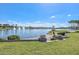 Scenic lake view with fountains, lush landscaping, and a serene atmosphere at 18233 W Hope Dr, Goodyear, AZ 85338