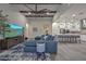 Inviting living area with a large sectional sofa and open access to the modern kitchen at 18233 W Hope Dr, Goodyear, AZ 85338