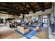 Expansive clubhouse lounge features vaulted wood beam ceilings and high-end furnishings for relaxing and gathering at 18233 W Hope Dr, Goodyear, AZ 85338