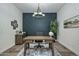 Elegant office space featuring a rustic desk, decorative wall accents, and stylish furnishings at 18233 W Hope Dr, Goodyear, AZ 85338