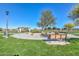 Beautiful community park with benches, walking path, shade, and picnic tables at 18233 W Hope Dr, Goodyear, AZ 85338