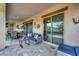 Covered patio featuring comfortable seating, an outdoor dining area, and scenic views at 18233 W Hope Dr, Goodyear, AZ 85338