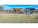Community playground area featuring slides, swings, and a shaded picnic area at 18233 W Hope Dr, Goodyear, AZ 85338