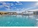 Large community pool with shaded lounge areas offering stunning views of the nearby mountains and sunny skies at 18233 W Hope Dr, Goodyear, AZ 85338