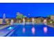Backyard pool featuring custom waterfalls, fire bowls, a hot tub, and mountain views at 18233 W Hope Dr, Goodyear, AZ 85338