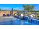 Stunning pool featuring water features and lake views, creating a serene backyard oasis at 18233 W Hope Dr, Goodyear, AZ 85338