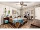 Cozy bedroom with a comfortable bed, a ceiling fan, and a connecting room perfect as an office or sitting area at 19258 N 20Th Dr, Phoenix, AZ 85027