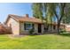 Single story home featuring lush green lawn, mature landscaping and desert flora, and a two car garage at 19258 N 20Th Dr, Phoenix, AZ 85027