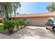 Single story home featuring lush green lawn, mature landscaping and desert flora, and a two car garage at 19258 N 20Th Dr, Phoenix, AZ 85027