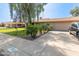 Single story home featuring lush green lawn, mature landscaping and desert flora, and a two car garage at 19258 N 20Th Dr, Phoenix, AZ 85027