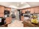 Well-lit kitchen boasting updated countertops, cabinets, stainless steel appliances, and an adjacent view of the living area at 19258 N 20Th Dr, Phoenix, AZ 85027