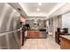 Open kitchen design, featuring stainless steel appliances, tiled floor, and warm lighting, ideal for cooking and entertaining at 19258 N 20Th Dr, Phoenix, AZ 85027