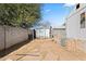 The backyard features a storage shed along with a cinder block wall at 1939 E Libby St, Phoenix, AZ 85022