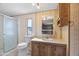 Bathroom with a vanity, toilet, shower, and a small window at 1939 E Libby St, Phoenix, AZ 85022