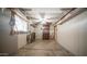 An unfinished basement with shelves, a window, and a door at 2002 S Apache Dr, Apache Junction, AZ 85120