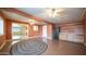 Spacious bonus room featuring neutral colors, multiple ceiling fans, and laminate flooring at 2002 S Apache Dr, Apache Junction, AZ 85120