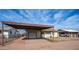 Charming single-story home featuring a carport, one-car garage, and traditional-style windows at 2002 S Apache Dr, Apache Junction, AZ 85120