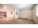 Spacious living room with carpeted floors and connection to the kitchen and entry door at 2002 S Apache Dr, Apache Junction, AZ 85120