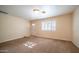 Living room featuring neutral paint, carpeted floors, and natural light from a window at 2002 S Apache Dr, Apache Junction, AZ 85120