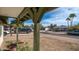 Neighborhood street view with trees, houses, and parked cars at 2002 S Apache Dr, Apache Junction, AZ 85120