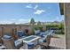 Private backyard featuring a cozy seating area with fire pit and a hot tub at 20631 W Minnezona Ave, Buckeye, AZ 85396