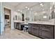 Well-lit bathroom featuring double sinks, and lots of counter space and storage at 20631 W Minnezona Ave, Buckeye, AZ 85396