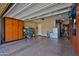Organized garage featuring built-in storage cabinets on both sides, providing efficient storage and workspace solutions at 20631 W Minnezona Ave, Buckeye, AZ 85396