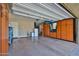 Spacious garage with ample storage cabinets on either side, offering plenty of room for vehicles and organization at 20631 W Minnezona Ave, Buckeye, AZ 85396