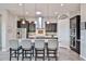 Modern kitchen features stainless steel appliances, granite countertops, and a stylish island at 20631 W Minnezona Ave, Buckeye, AZ 85396