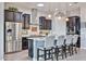 Modern kitchen features stainless steel appliances, granite countertops, and a stylish island at 20631 W Minnezona Ave, Buckeye, AZ 85396