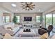 Spacious living room boasts lots of natural light, neutral colors, and stylish décor at 20631 W Minnezona Ave, Buckeye, AZ 85396