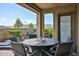 Inviting outdoor patio with mountain views, a dining table set, and comfortable seating creates an ideal relaxation space at 20631 W Minnezona Ave, Buckeye, AZ 85396