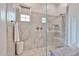 Walk-in shower with built-in shelves and stylish tile for a relaxing retreat at 20631 W Minnezona Ave, Buckeye, AZ 85396