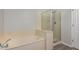 Bathroom features a separate tub and glass-enclosed shower at 20660 N 40Th St # 1112, Phoenix, AZ 85050